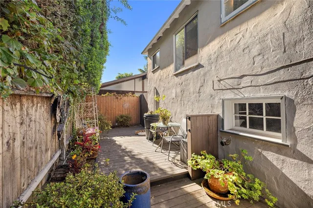 a backyard of a house with outdoor seating