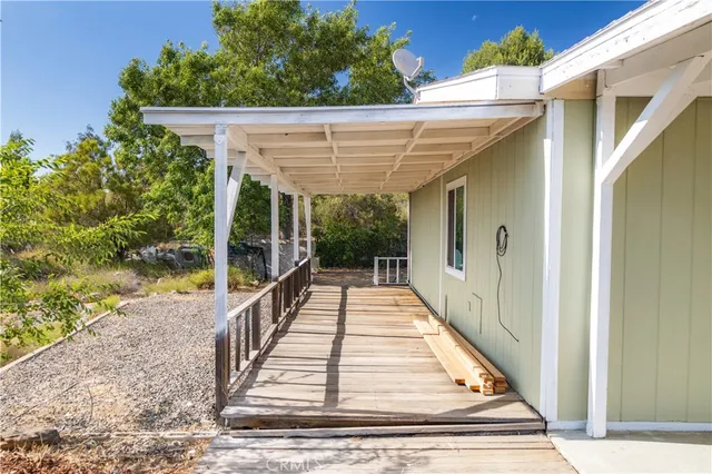 a view of balcony with wooden floor and outdoor space