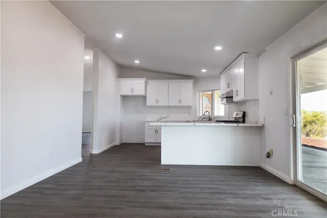 a view of kitchen with wooden floor