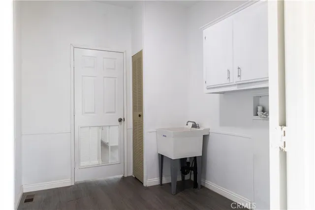 a view of cabinets and wooden floor