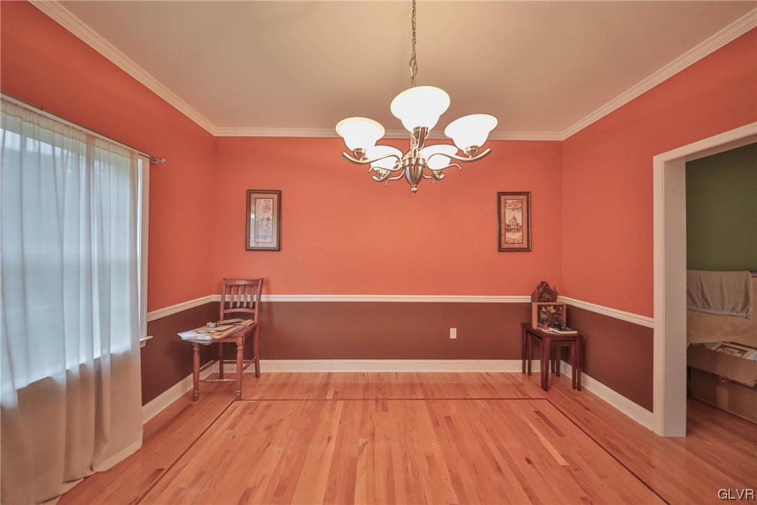 1743 Pen Argyl Road Pen Argyl, PA 18072 - Photo 11 of 38 a view of a room with wooden floor and lounge chair
