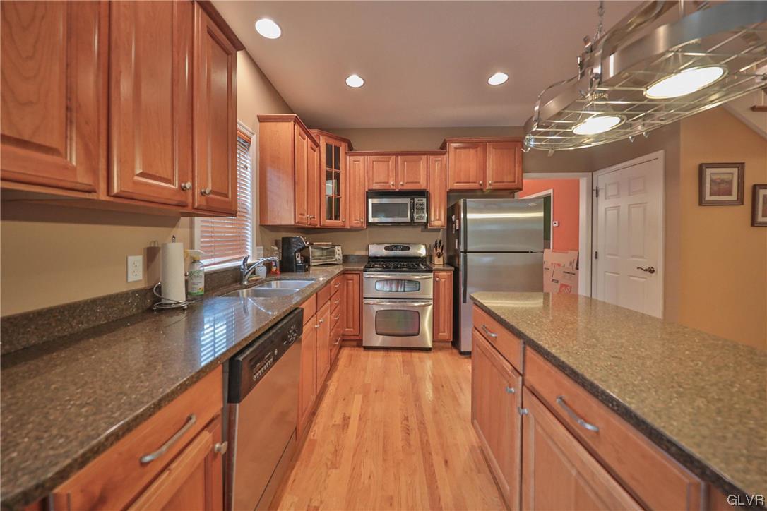 1743 Pen Argyl Road Pen Argyl, PA 18072 - Photo 15 of 38 a large kitchen with kitchen island a large counter top space a sink stainless steel appliances and cabinets
