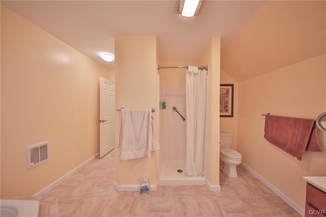 1743 Pen Argyl Road Pen Argyl, PA 18072 - Photo 23 of 38 a bathroom with a shower and toilet