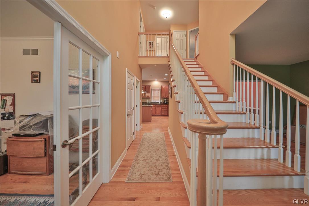 1743 Pen Argyl Road Pen Argyl, PA 18072 - Photo 6 of 38 a view of staircase with lots of frames on wall and windows