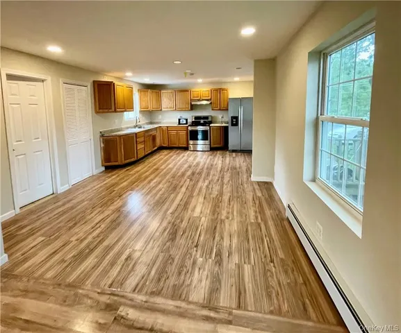 a view of kitchen with wooden floor