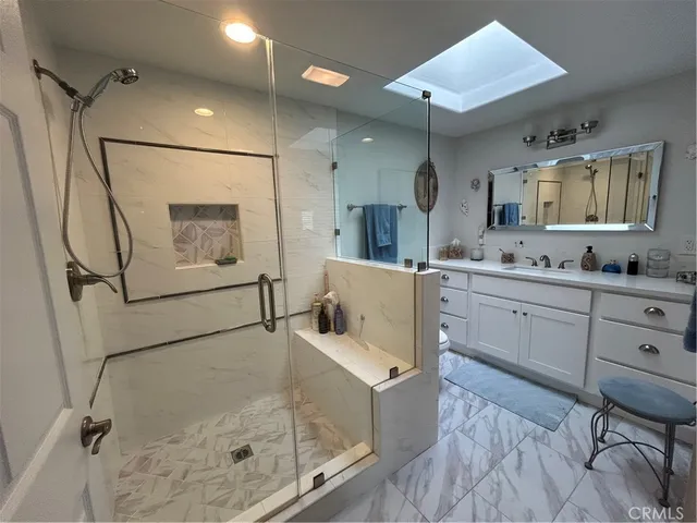 a kitchen with a refrigerator a sink and cabinets