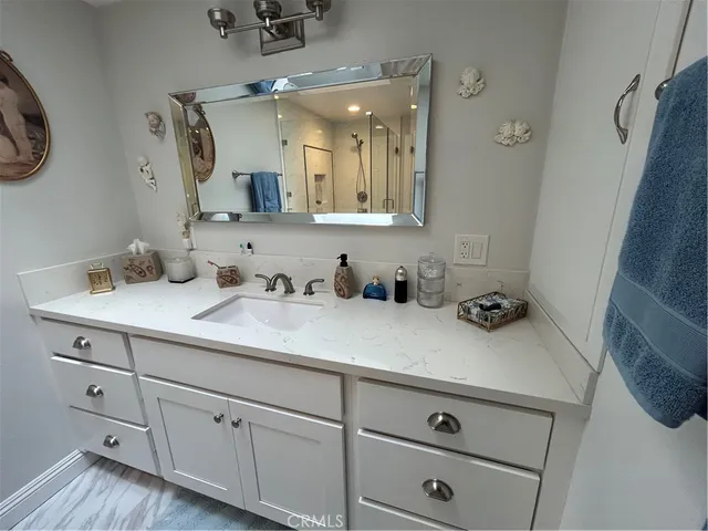 a bathroom with a sink and a mirror