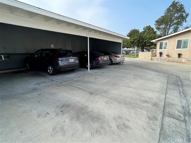 a view of parking area with parked cars