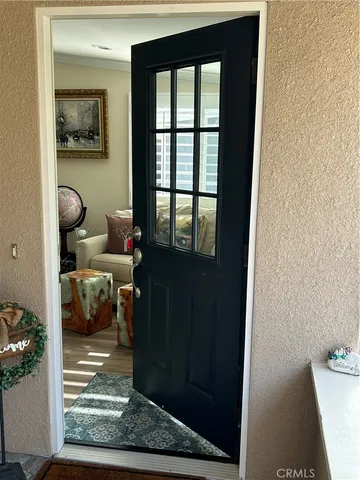 a living room with furniture and a rug