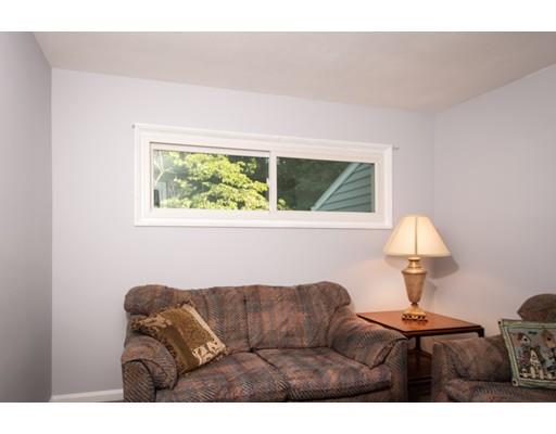 66 Audley Road Springfield, MA 01118 - Photo 8 of 30 a living room with furniture and a lamp