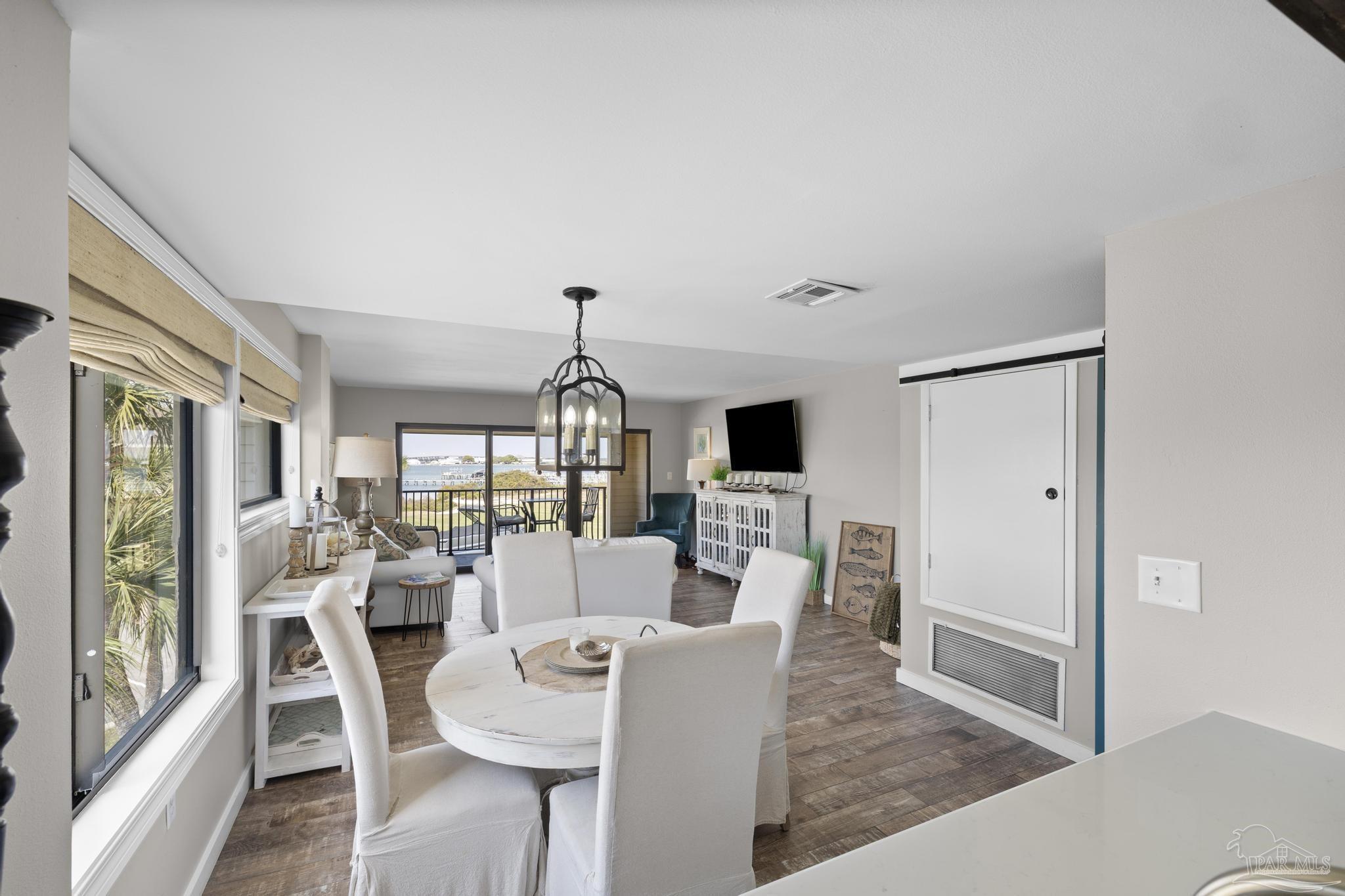 900 Fort Pickens Road, Unit 426 Pensacola Beach, FL 32561 - Photo 17 of 60 a living room with furniture a window and a flat screen tv