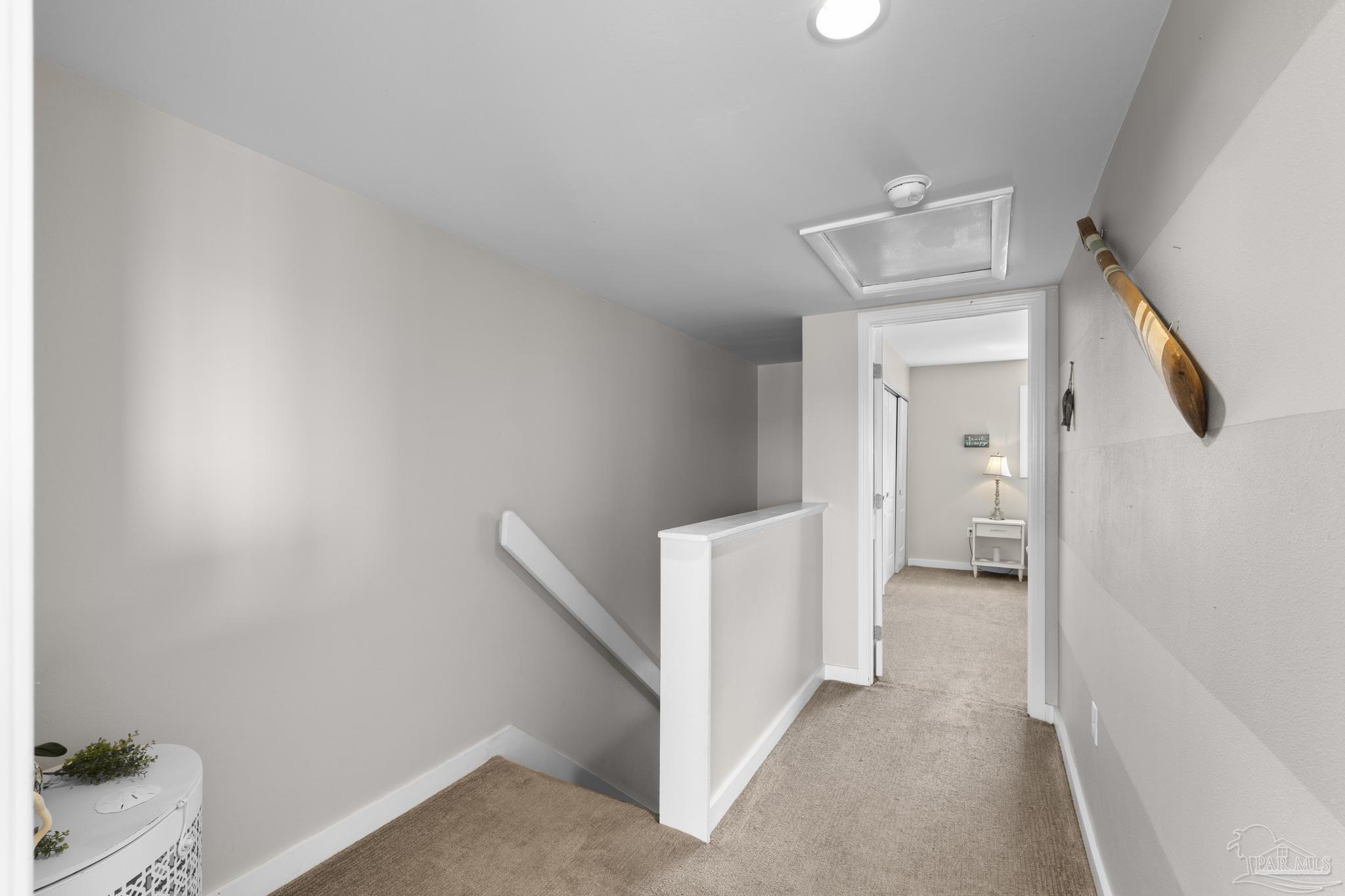 900 Fort Pickens Road, Unit 426 Pensacola Beach, FL 32561 - Photo 23 of 60 a view of a room with wooden floor and a hallway