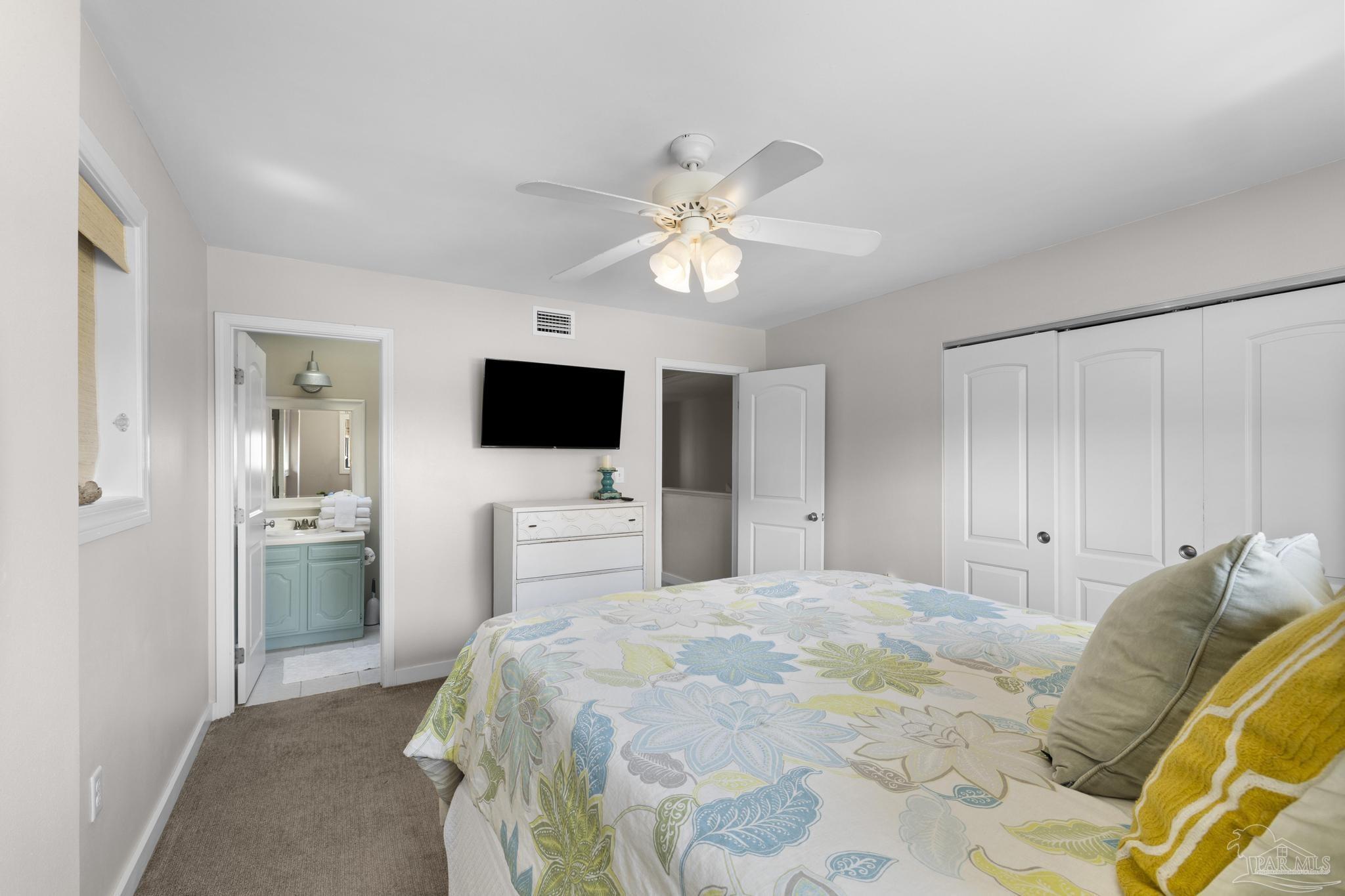 900 Fort Pickens Road, Unit 426 Pensacola Beach, FL 32561 - Photo 26 of 60 a bedroom with a bed window and a flat screen tv