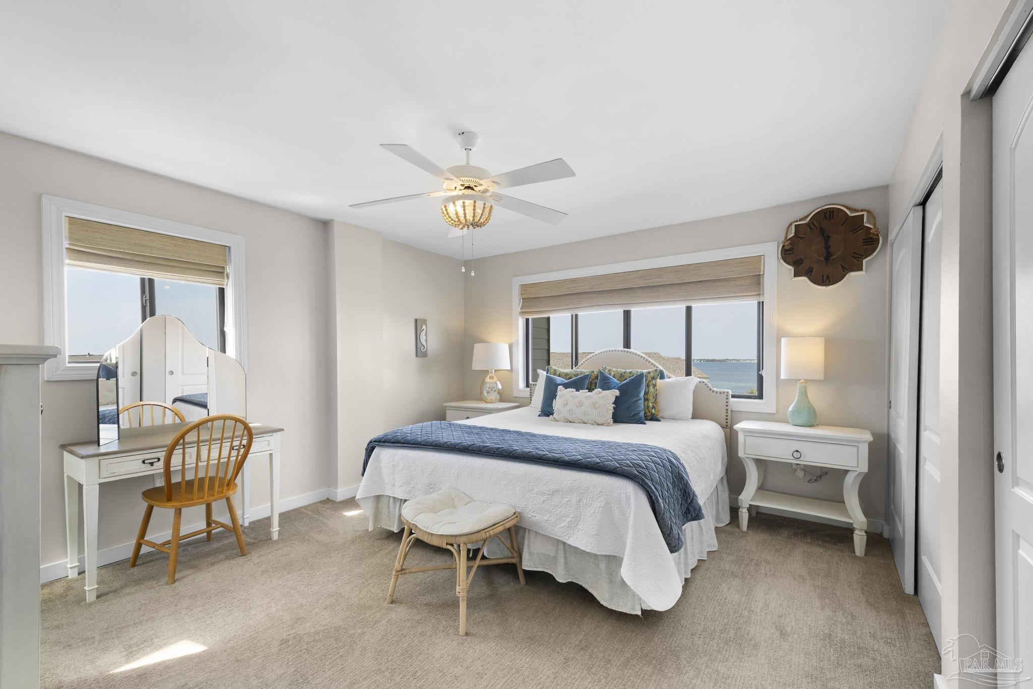 900 Fort Pickens Road, Unit 426 Pensacola Beach, FL 32561 - Photo 28 of 60 a bed room with a bed and a chair