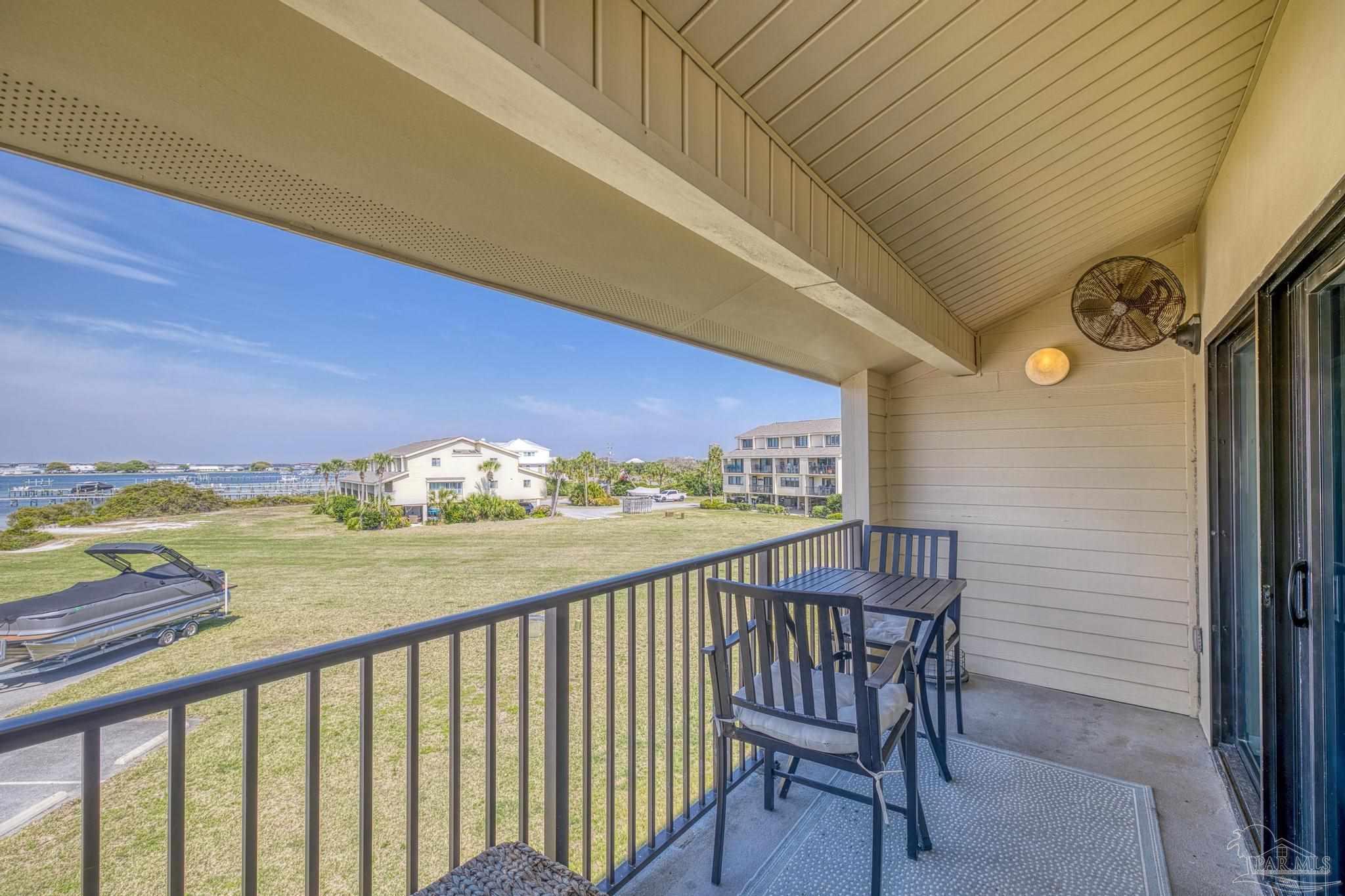 900 Fort Pickens Road, Unit 426 Pensacola Beach, FL 32561 - Photo 33 of 60 a view of a chairs and table in the balcony