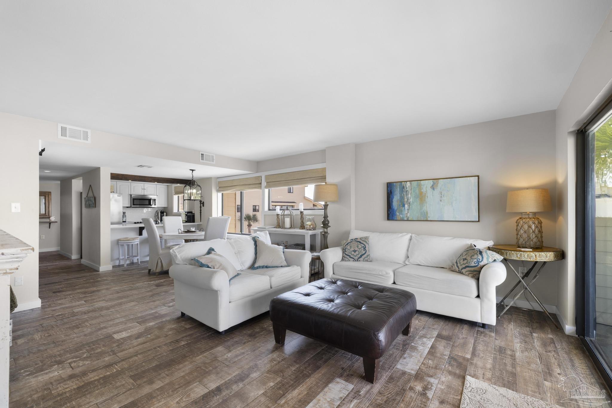 900 Fort Pickens Road, Unit 426 Pensacola Beach, FL 32561 - Photo 5 of 60 a living room with furniture and a wooden floor