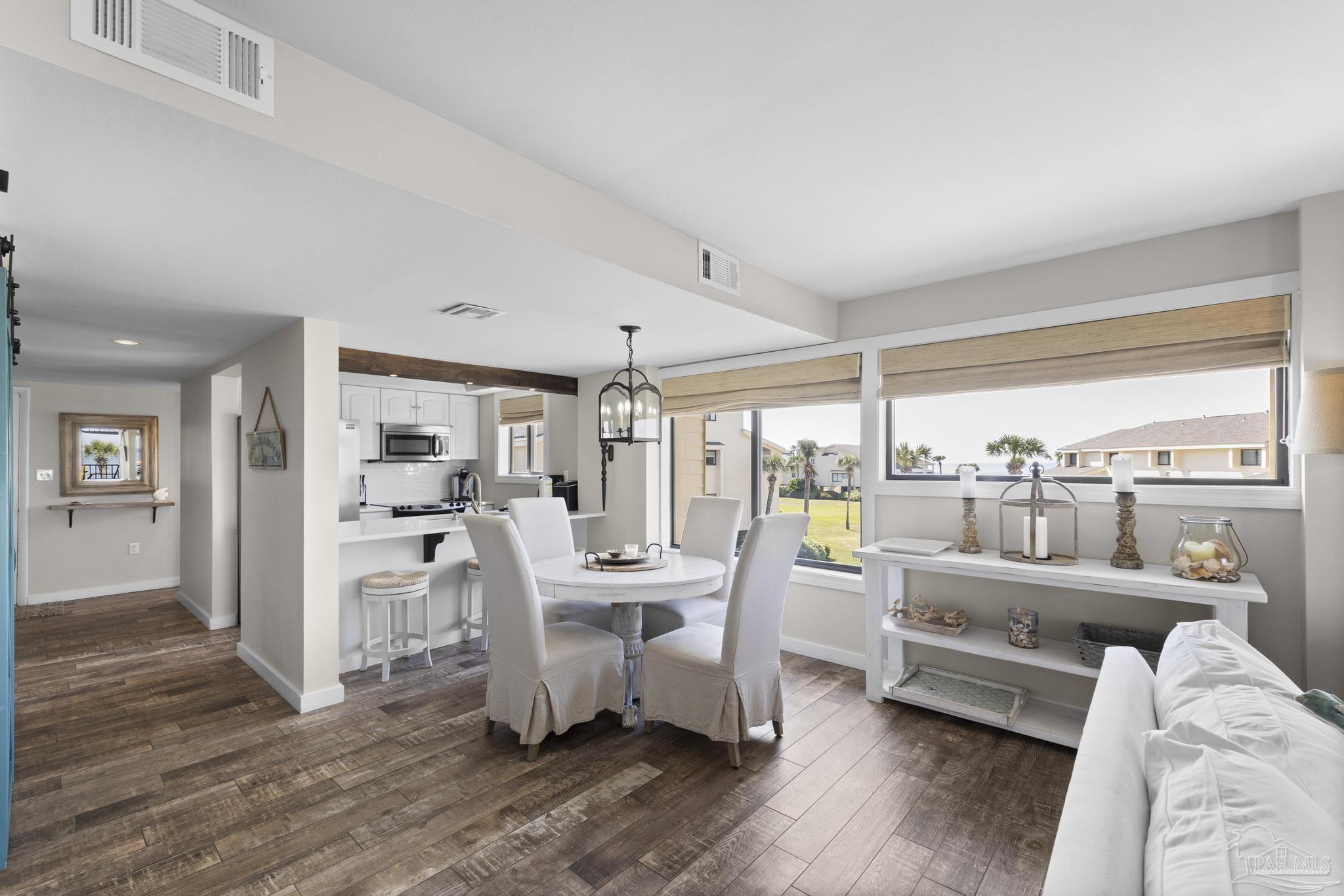 900 Fort Pickens Road, Unit 426 Pensacola Beach, FL 32561 - Photo 6 of 60 a living room with furniture and a large window