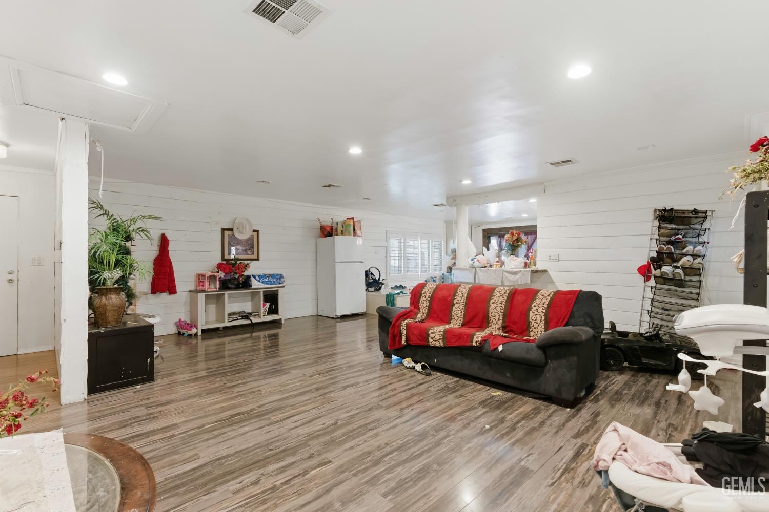 Undisclosed Address Maricopa, CA 93252 - Photo 11 of 40 a living room with furniture a rug and a potted plant
