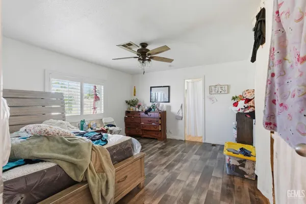 a bedroom with bed and a window