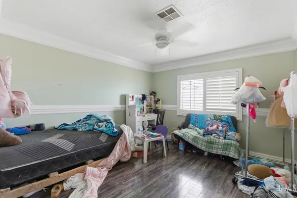 a bedroom with furniture and a window