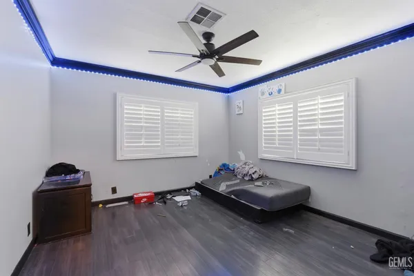 a bedroom with furniture and a window