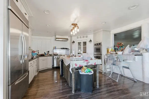 a kitchen with a sink and refrigerator