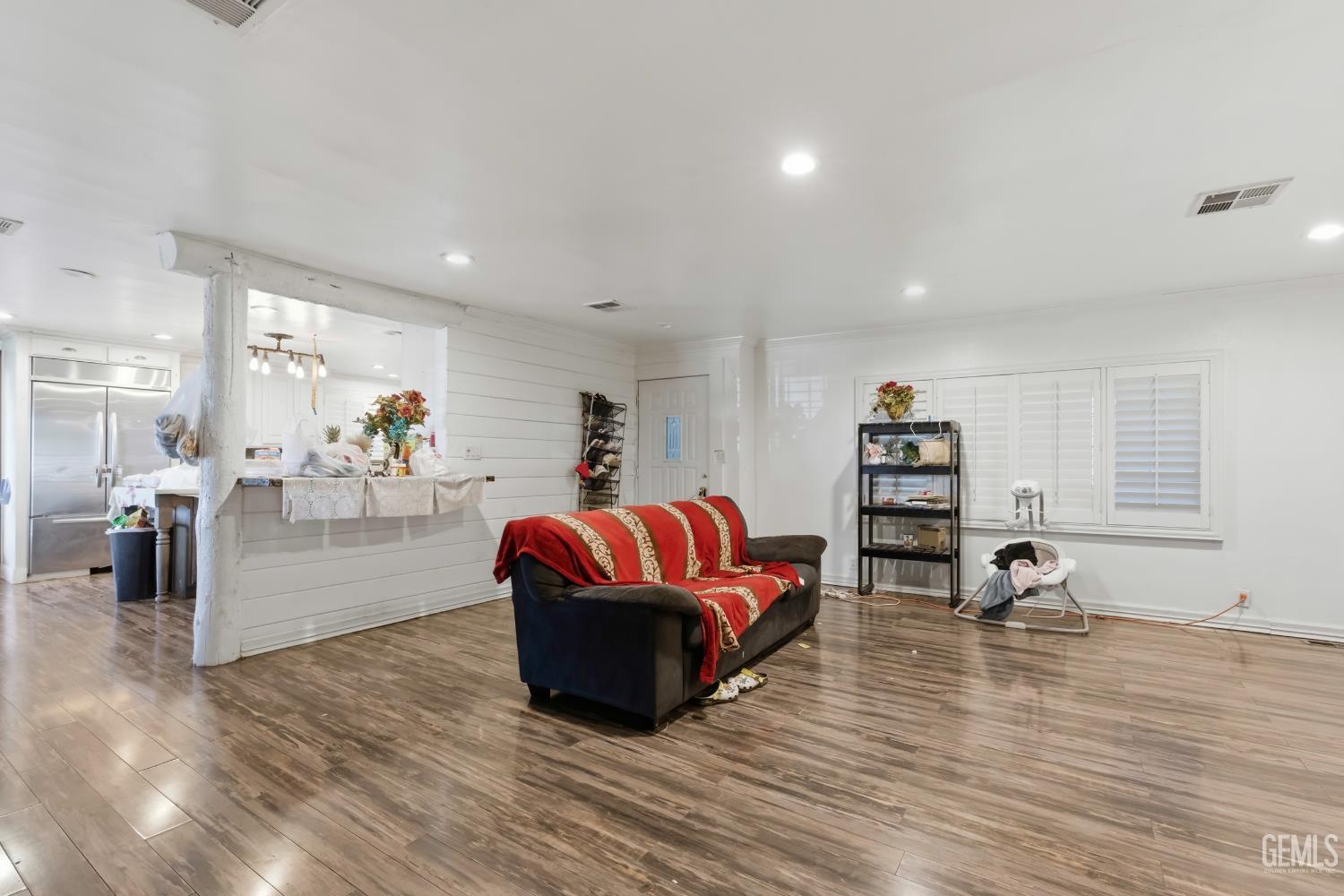 Undisclosed Address Maricopa, CA 93252 - Photo 10 of 40 a living room with furniture and a wooden floor