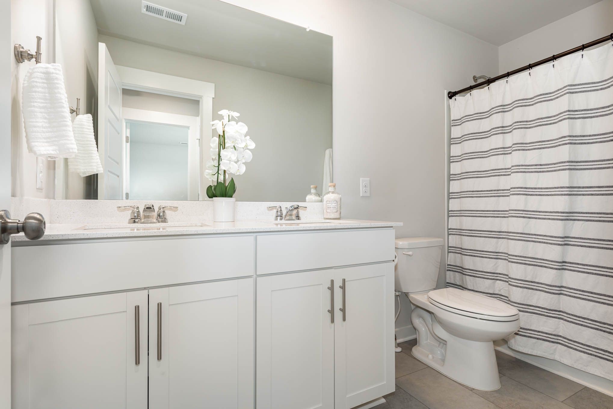 478 Irwin Way Spring Hill, TN 37174 - Photo 12 of 16 a bathroom with a toilet sink vanity and mirror