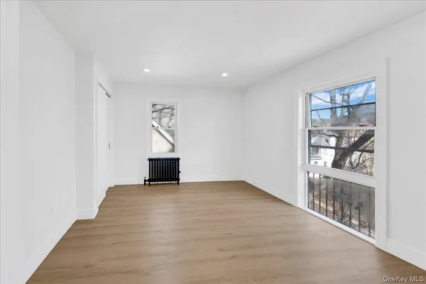wooden floor in a room with a window