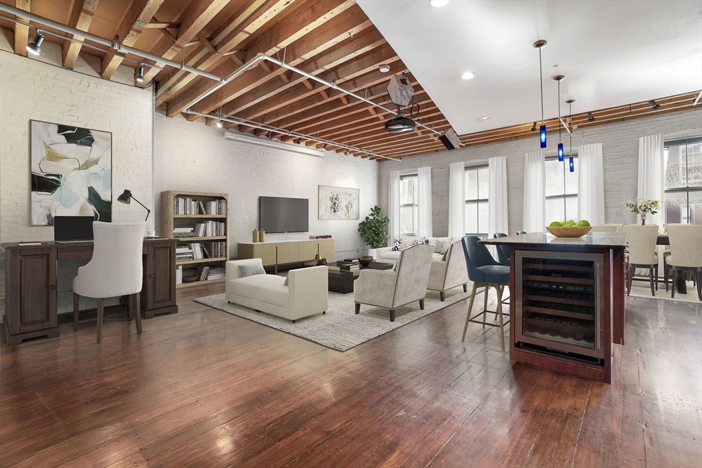 96 South Street, Unit 3 Boston, MA 02111 - Photo 3 of 17 a living room with furniture a wooden floor and next to a window