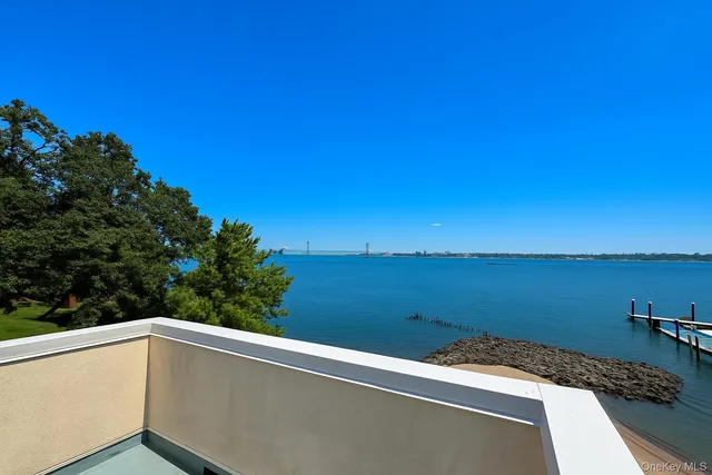 a view of a balcony with ocean view