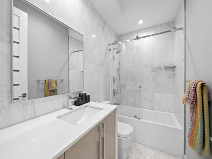 a bedroom with a large bed and a large window