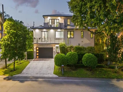 a terrace with outdoor seating and city view