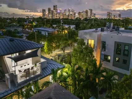 an aerial view of residential houses and lake view