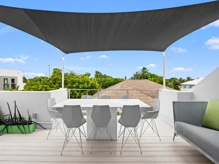 a patio with table and chairs