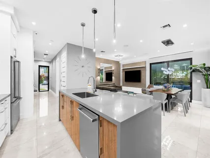 a view of a dining room with furniture and a large window