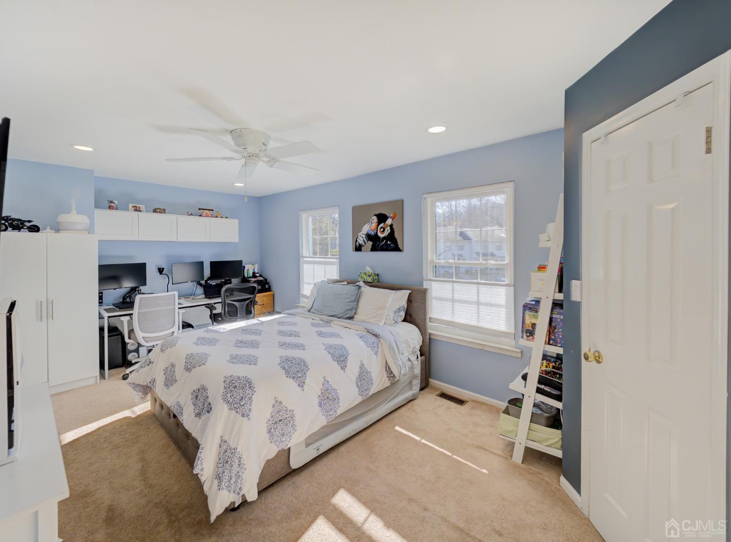 1103 Timber Oaks Road Edison, NJ 08820 - Photo 20 of 27 a spacious bedroom with a bed and a cabinets