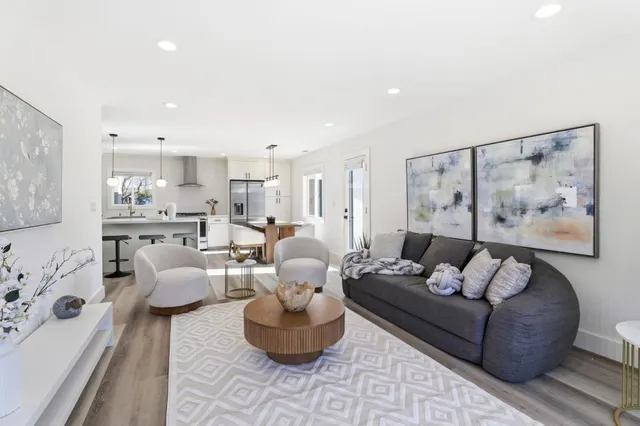 a living room with furniture and a painting