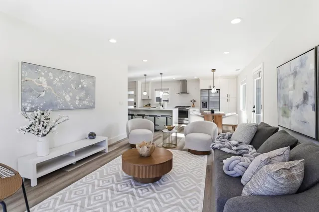 a living room with furniture and a painting