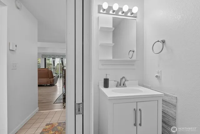 a en suite bathroom with a sink and mirror