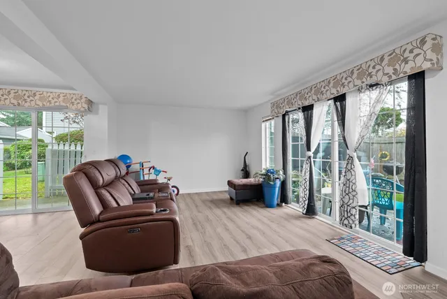 a bedroom with a bed and glass window
