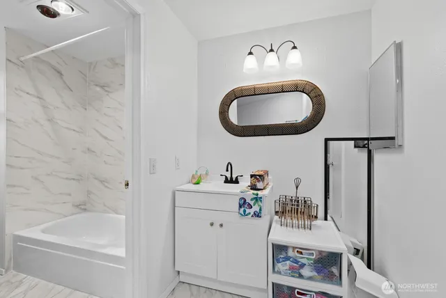 a bathroom with a sink and a mirror