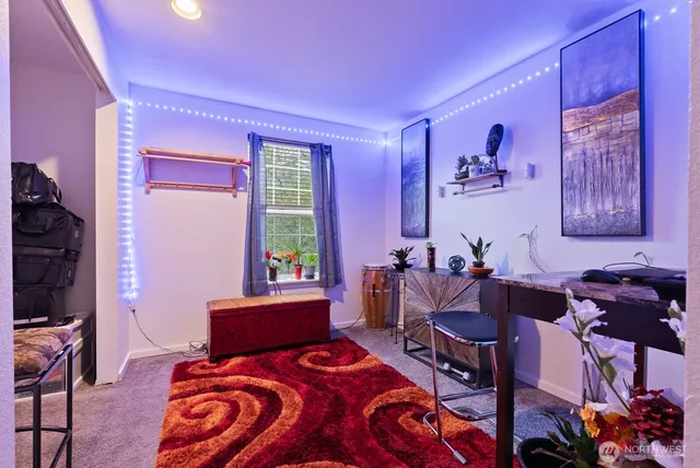 a bedroom with furniture and a window