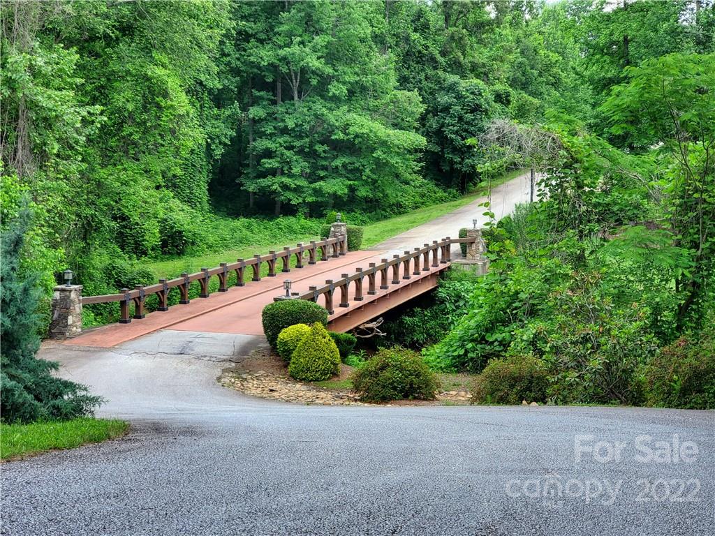 7 West Rambling Creek Drive Tryon, NC 28782 - Photo 14 of 15 a view of a garden with an outdoor seating area