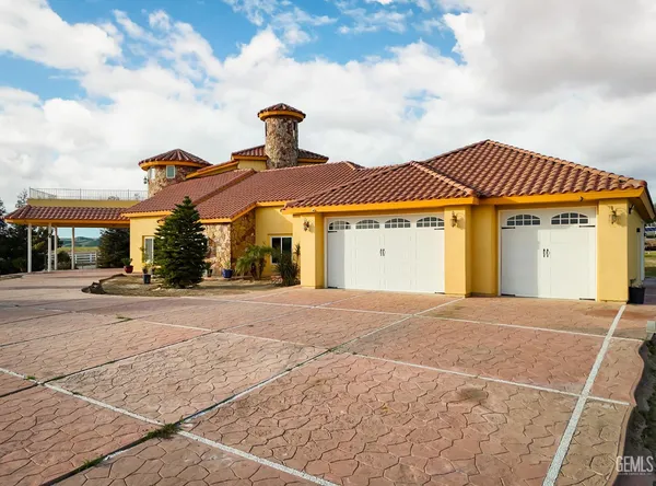 a living room with furniture rug and a large window
