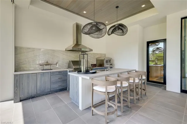 a kitchen with a table and chairs in it