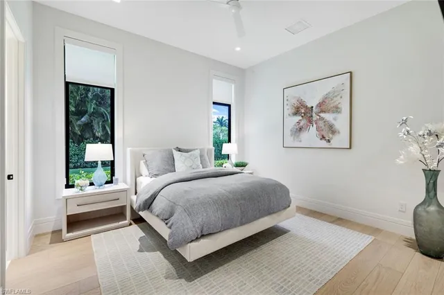 a bedroom with a large bed and a window