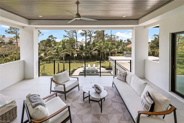 a spacious bedroom with a bed and a large window
