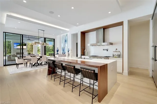 a kitchen with a table and chairs in it