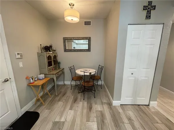 a view of a dining room with furniture wooden floor and a rug